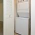 In-unit stacked washer and dryer at Paoli Place Apartments in Paoli, PA.