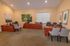 Interior of the leasing and management office furnished with desks and chairs at Rosetree Crossing Apartments in Media, PA.