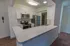 Model kitchen with stainless steel appliances and a large breakfast bar at Paoli Place Apartments in Paoli, PA.