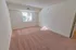 Carpeted model bedroom with large windows at Paoli Place Apartments in Paoli, PA.