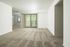 Bright and spacious living area with plush carpet, large window with vertical blinds, and an inviting open layout.