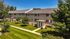 Charming apartment complex with lush greenery and well-maintained grounds, offering a peaceful and inviting ambiance.