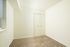 Bright, cozy room with plush carpet, built-in closet, and ample natural light from a window with blinds.