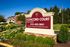 Welcome to Concord Court Apartments, surrounded by lush greenery and offering a serene living environment with convenient amenities.