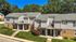 Charming townhouse complex with lush greenery, modern design, and inviting entryways, perfect for serene living.