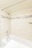 Elegant bathroom with modern shower and chic tile accents.