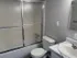 bathtub with sliding glass doors