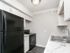 black appliances and white countertops