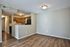 living room and kitchen with hardwood floors at Silver Springs Apartments in Springfield MO