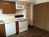 kitchen with white appliances at Silver Springs Apartments in Springfield MO