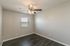 bedroom with hardwood floors and ceiling fan at Eastview Apartments in Springfield MO