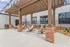 Charming outdoor lounge area featuring cozy hammocks under a stylish wooden pergola, perfect for relaxation.