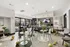Bright and modern community space with elegant decor, featuring stylish seating, festive balloons, and a welcoming snack bar counter.