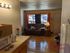 Inviting living space in Westridge One Bedroom apartment with cozy sofa, large sunlit window, and modern kitchen counter.