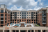 Resort-style pool at apartments near Auburn University. Modern apartment complex featuring stylish architecture, inviting outdoor pool area, and a vibrant ambiance.