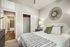 Bedroom with door to bath | Urban Oaks | Apartments in Conroe