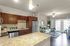Beautiful open-plan kitchen and living area with modern appliances, designed with style in mind.