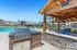 Modern apartment complex featuring a stunning outdoor pool, comfortable lounge areas, and a built-in grilling station.