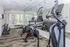 Fully-equipped gym with stationary bikes, free weights, and modern exercise machines in a well-lit space.