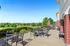 Elegant outdoor terrace with scenic golf course views.