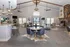 Spacious and elegant lounge area with modern furniture, stylish lighting, and a cozy fireplace.