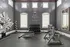 Luxury home gym with modern exercise equipment, stylish decor, and natural light creating an inviting workout space.