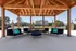 Inviting outdoor gazebo featuring modern navy seating with vibrant cushions, perfect for relaxation and entertaining.
