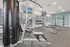 Modern fitness center with cutting-edge gym equipment, well-lit and spacious for an invigorating workout experience.
