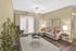 Inviting living room with elegant decor, stylish furniture, and abundant natural light creating a cozy atmosphere.