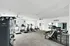 Bright and modern fitness center with state-of-the-art equipment, including treadmills, stationary bikes, and strength training machines.