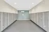 Modern mailroom with organized silver mailboxes and sleek blue accent wall, offering convenience and security for residents.