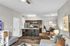 Modern open-concept living space with a stylish kitchen, cozy seating area, and elegant dining nook, perfect for entertaining.