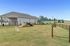 Inviting outdoor space with pet-friendly agility course and well-maintained lawn, perfect for active play.