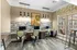 Chic workspace with modern design, multiple computer stations, and vibrant decor, offering a bright and collaborative environment.