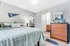 Inviting bedroom with a stylish bed, modern decor, and attached bathroom for ultimate comfort.