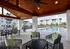 Chic outdoor lounge with cozy seating and inviting poolside view, perfect for relaxation and entertaining in a stylish community setting.