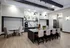 Elegant communal space showcasing a modern design with a large marble island, plush seating, stylish pendant lighting, and sophisticated decor.