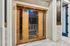 Elegant home sauna with wooden doors, offering a luxurious and relaxing retreat in a modern interior space.