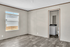 Bright and airy room with elegant flooring and a convenient ensuite bathroom, perfect for modern living.
