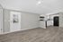 Inviting modern kitchen space with sleek white cabinetry, open layout, and natural light enhancing the airy ambiance.