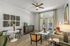 Elegant modern living room featuring stylish decor, cozy seating arrangement, and abundant natural light through large windows.