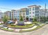 Modern apartment complex, The Icon at Yorktown, showcasing contemporary architecture and lush landscaping.