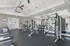 Bright and spacious gym with modern fitness equipment, including treadmills and weight stations, inviting you to a healthy lifestyle.