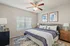Inviting bedroom with a plush king-size bed, stylish decor, and warm natural light complementing the tranquil ambiance.