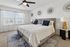 Inviting bedroom with elegant d&eacute;cor, plush bedding, and natural light, creating a cozy retreat.