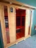Luxurious infrared sauna with elegant wood paneling and modern digital controls.