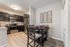Chic kitchen and dining area with modern appliances, elegant cabinetry, and stylish decor, perfect for entertaining.