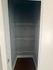 Spacious closet with built-in shelving, perfect for organized storage solutions.