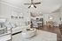 Inviting open-concept living space with a modern kitchen, elegant dining area, and cozy seating, perfect for relaxation and entertaining.
