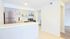 Bright and modern kitchen with sleek stainless steel appliances and elegant cabinetry, offering a perfect blend of style and functionality.